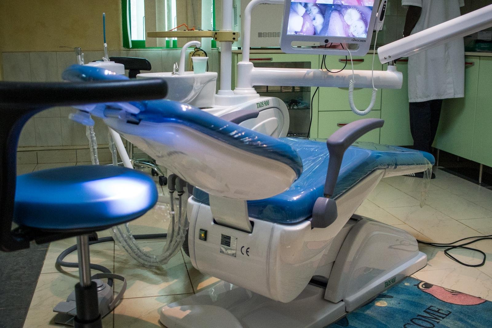 Close-up of a dental unit, stool and delivery arm in a Lux Dental Clinic surgery