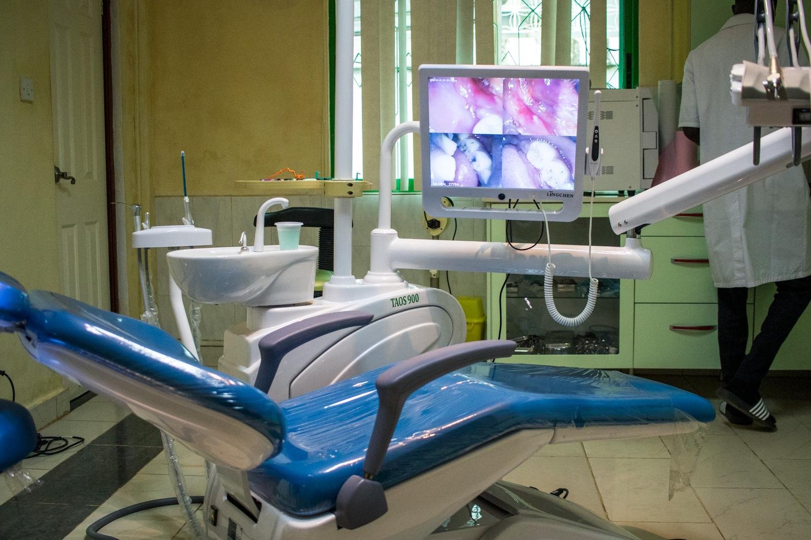 Dental treatment chair with overhead light and intra-oral camera monitor in a Lux Dental Clinic surgery