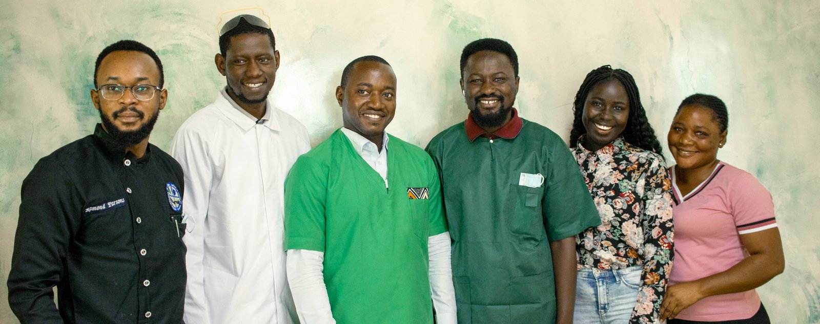 The Lux Dental Clinic team photographed together at the practice on Kairaba Avenue